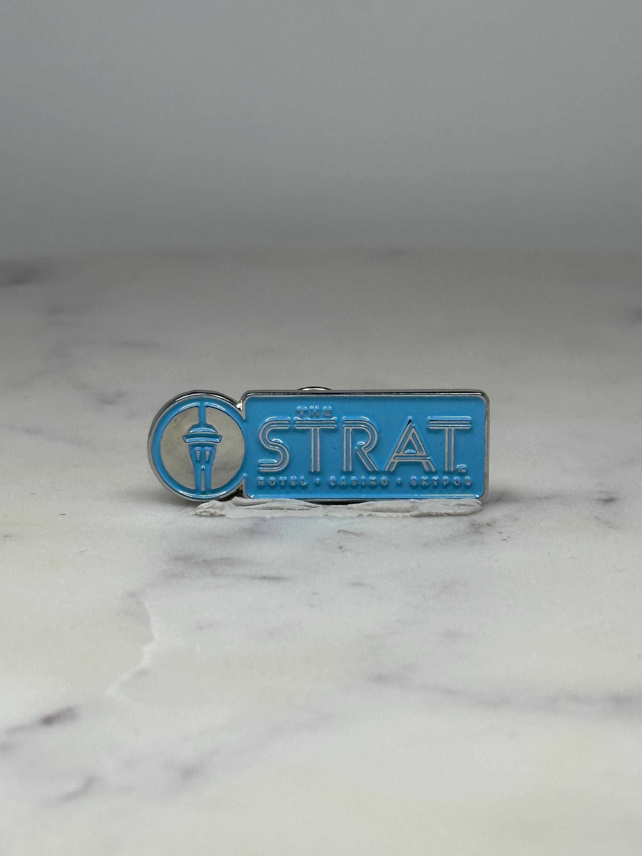 The STRAT Hotel Casino Pin: Sky Blue Enamel - Las Vegas Souvenir Accessory