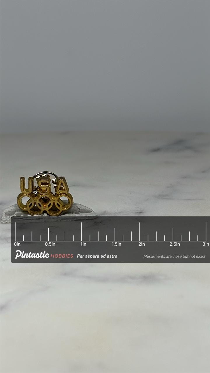 USA Olympic Pin: Gold Tone Enamel - Vintage Sports Accessory with ruler overlay for size reference