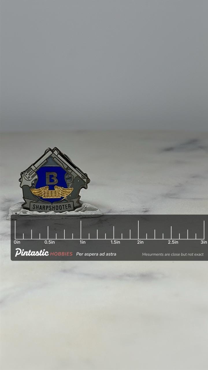 Brink's Sharpshooter Pin: Silver & Blue Emblem - Tactical Award Accessory with ruler overlay for size reference