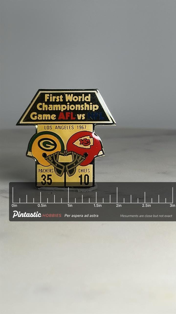 Super bowl i commemorative pin: enamel finish - 1967 football accessory with ruler overlay for size reference