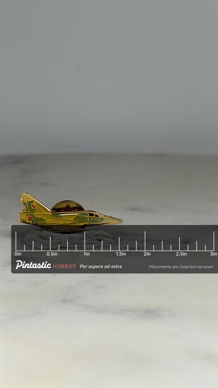 Vintage Delta Wing Fighter Jet Pin: Camouflage Enamel - Military Aviation Accessory with ruler overlay for size reference