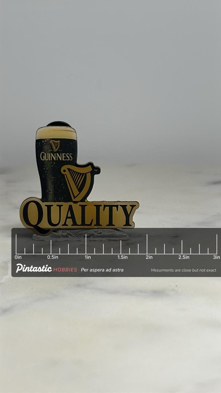Guinness Beer Pin: Black & Gold Enamel - Vintage Pub Accessory with ruler overlay for size reference