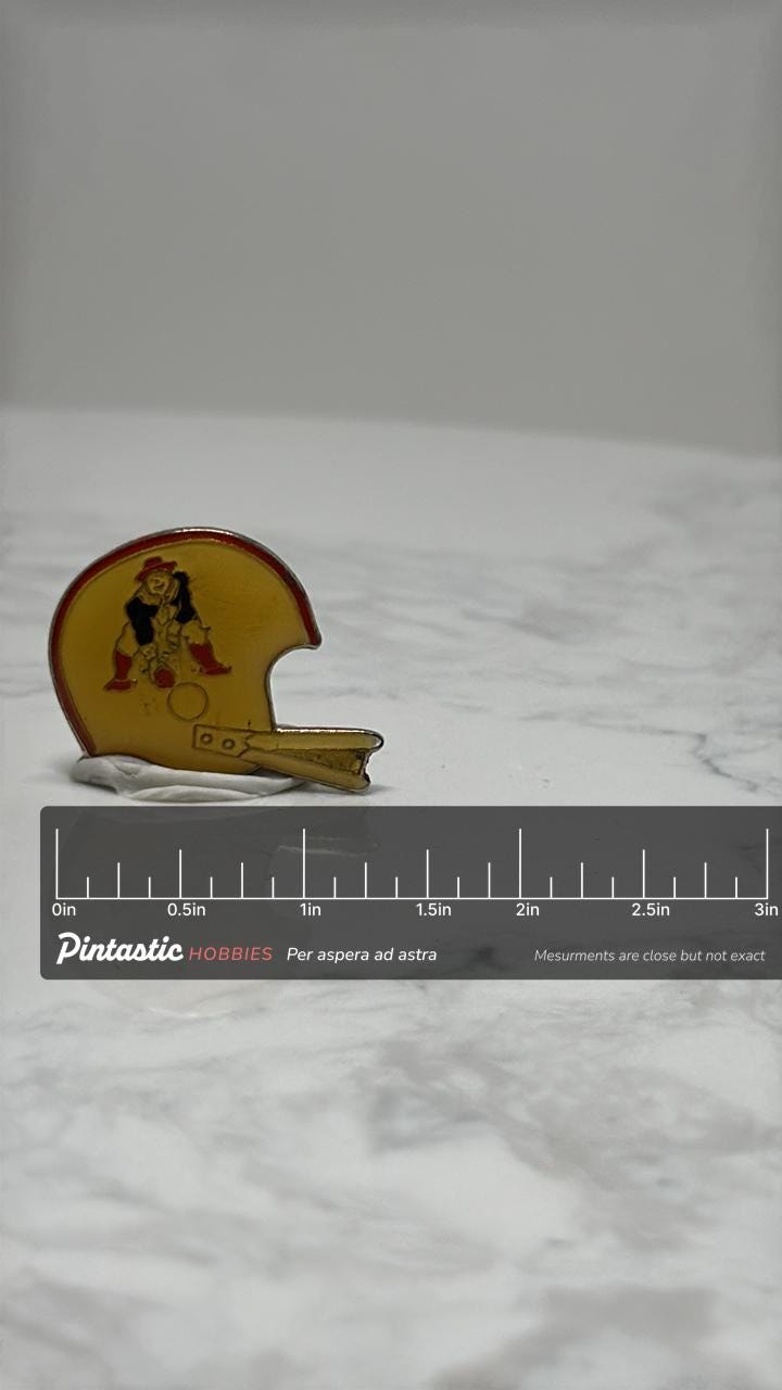 New England Patriots Helmet Pin: Amber Enamel Finish - Vintage Sports Accessory with ruler overlay for size reference