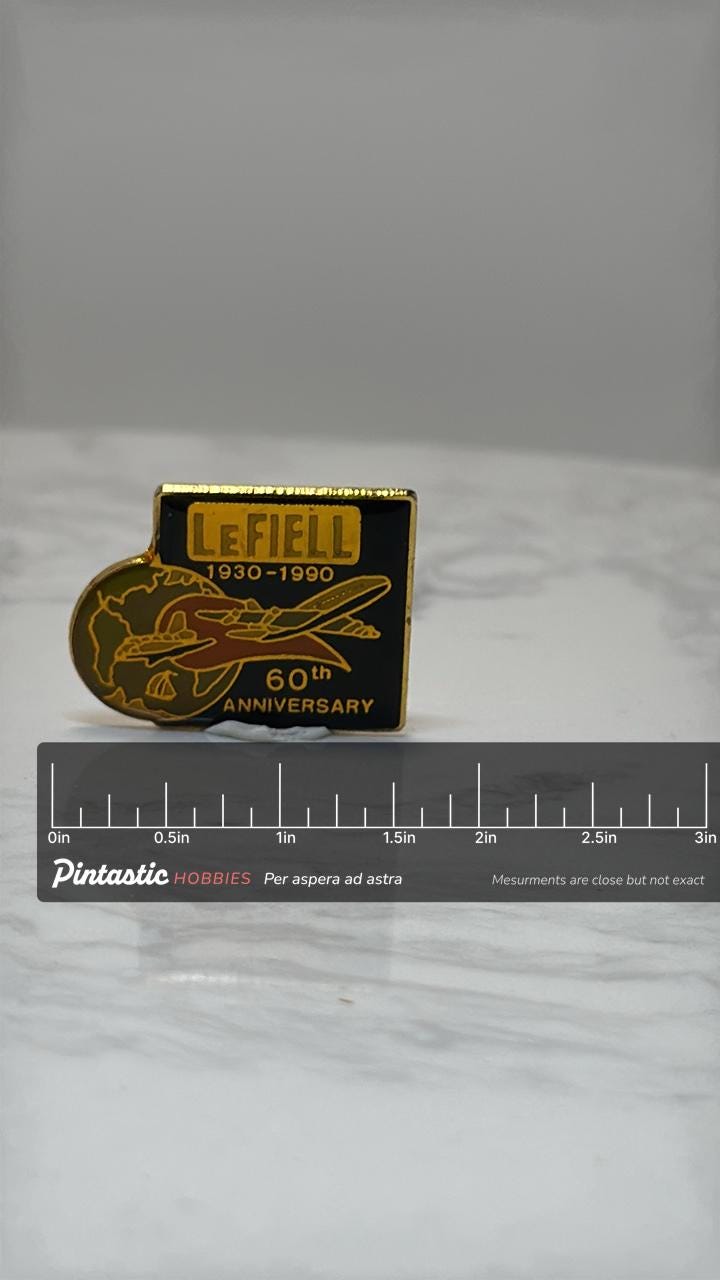 Lefiell 60th Anniversary Pin: Black Enamel Gold Trim - 1990s Commemorative Accessory with ruler overlay for size reference