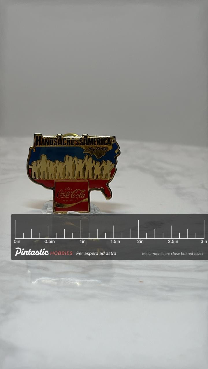 Hands Across America Pin: Red Yellow Enamel - 1986 Coca-Cola Accessory with ruler overlay for size reference