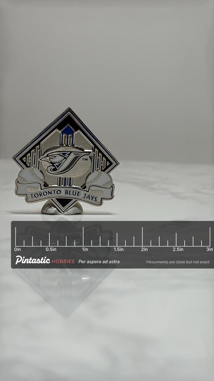 Toronto Blue Jays Baseball Pin: Silver & Blue Enamel - MLB Sports Accessory with ruler overlay for size reference