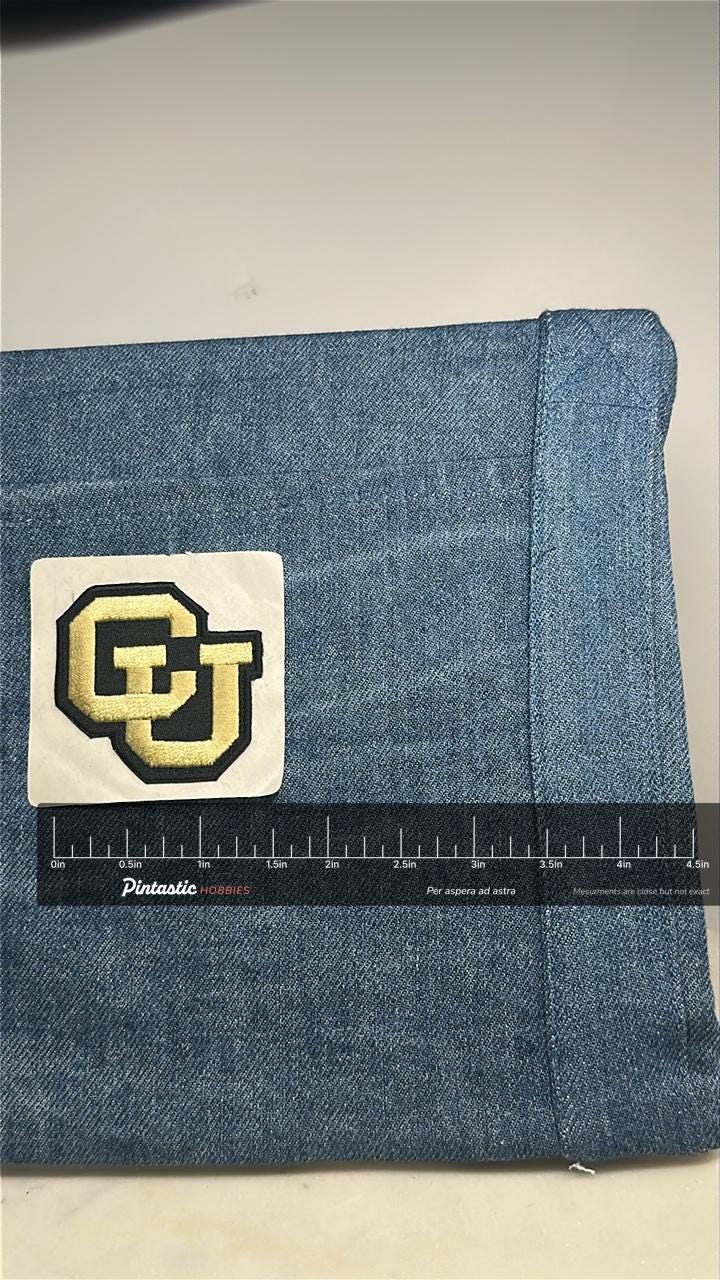 CU Boulder Collectable Peel and Stick Patch: Gold & Black Logo - College Accessory with ruler overlay for size reference