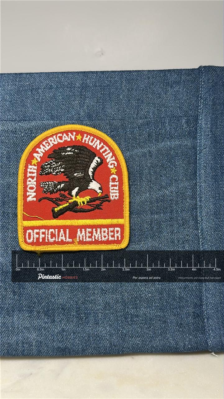North American Hunting Club Collectable Patch: Red & Gold - Vintage Accessory with ruler overlay for size reference