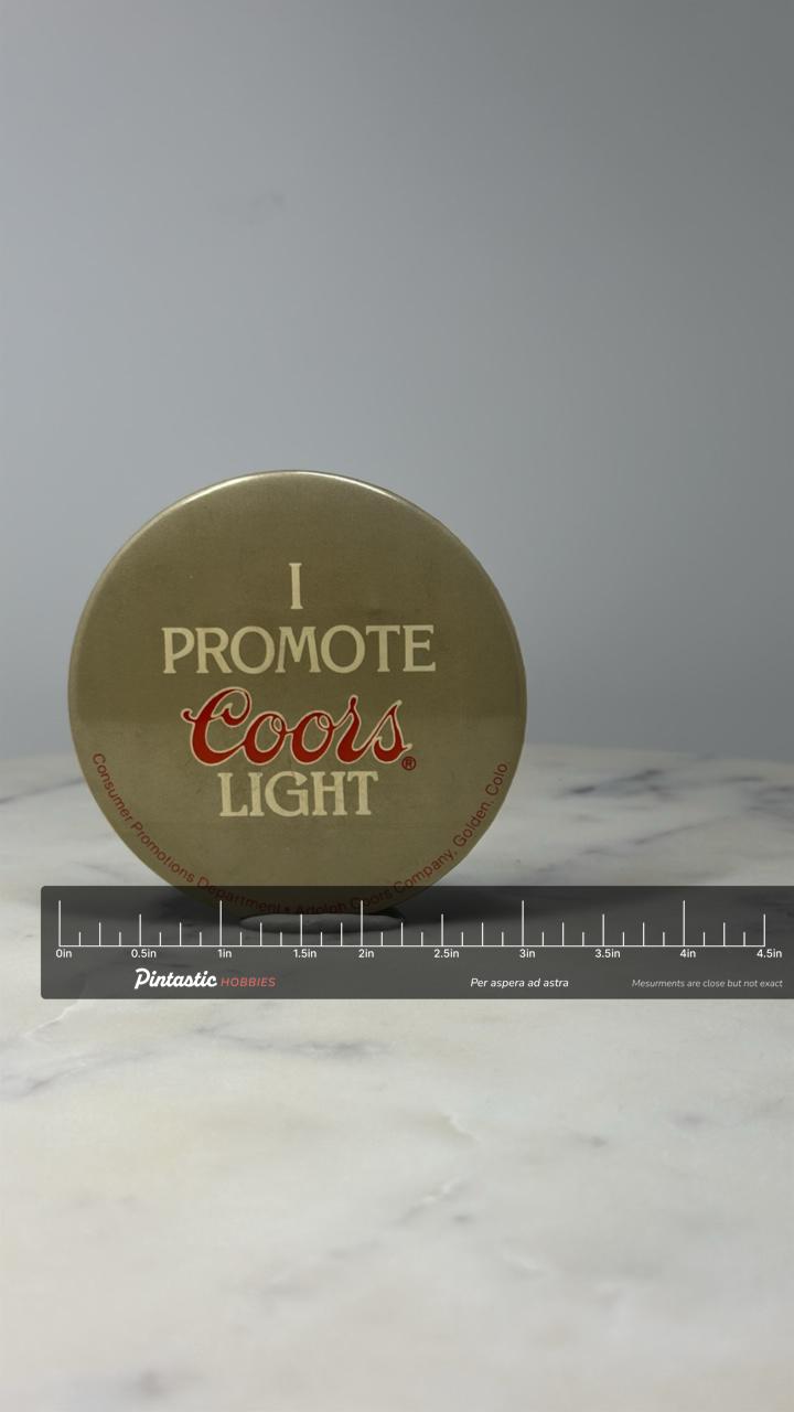 Coors Light Advertising Button Pin: Gold Tone - Beer Promo Accessory with ruler overlay for size reference