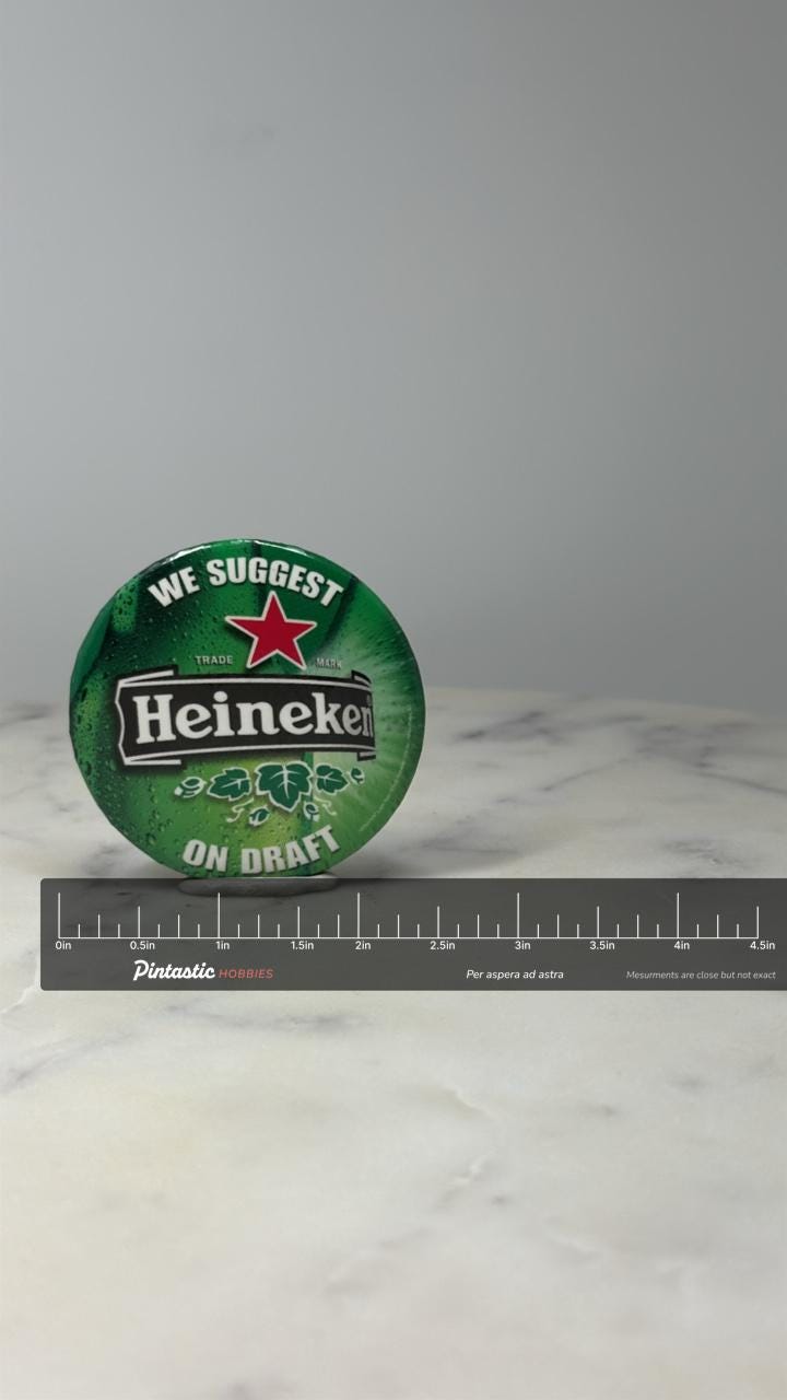 Heineken Beer Advertising Button Pin: Green Glossy - Bar Promo Accessory with ruler overlay for size reference