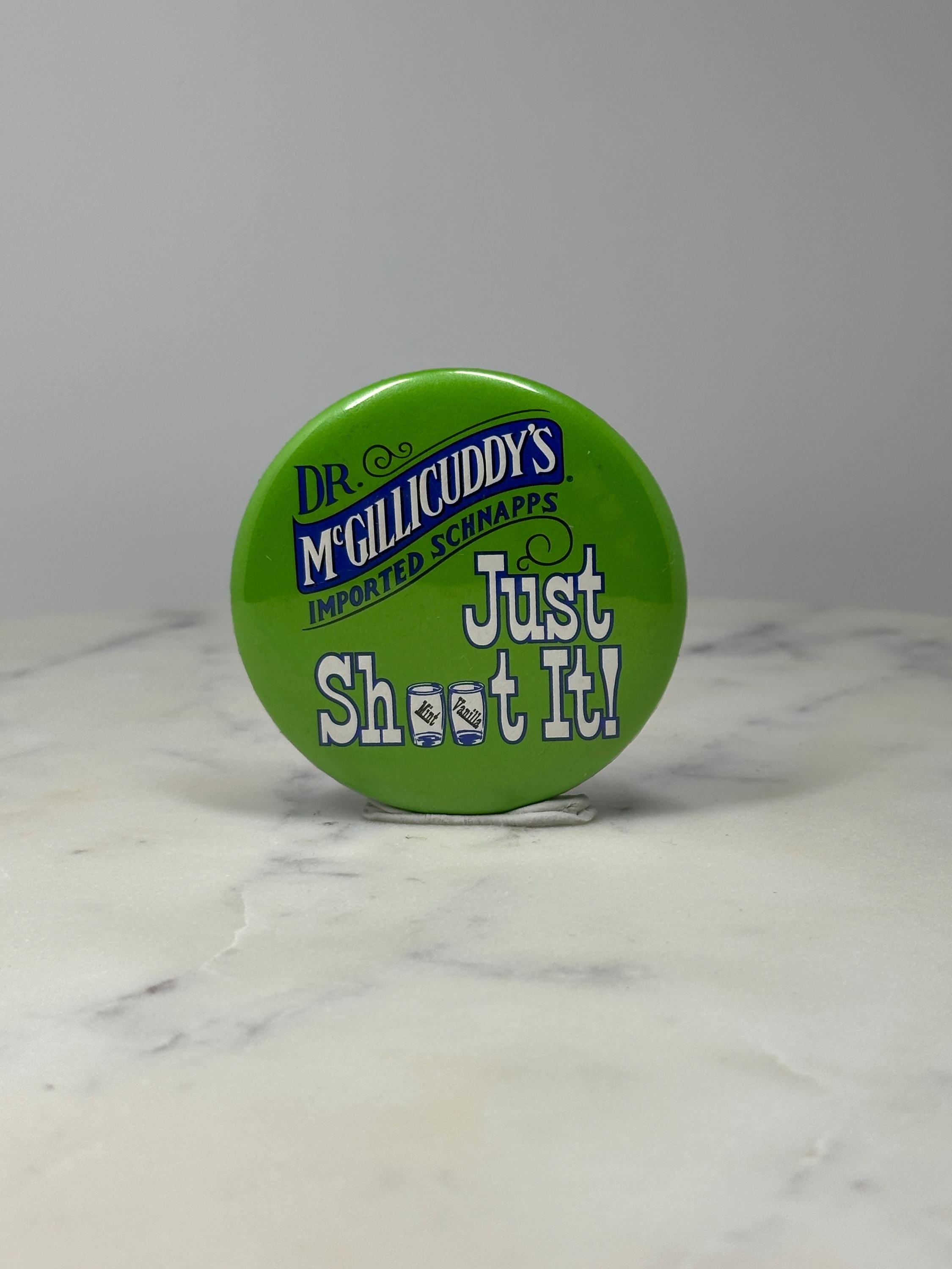 Dr McGillicuddys Schnapps Button Pin: Green Promo - Bar Advertising