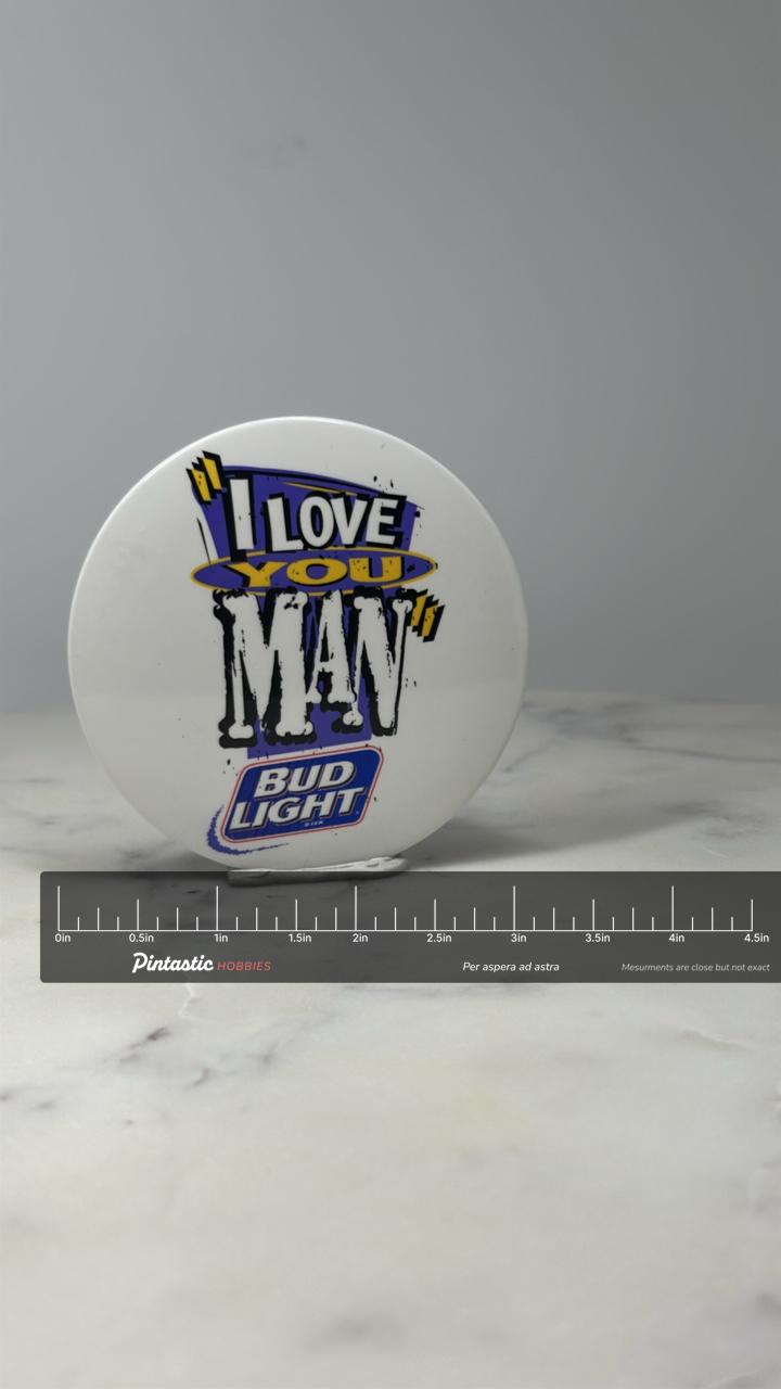 Bud Light Advertising Button Pin: White 1990s Beer Promo Accessory with ruler overlay for size reference