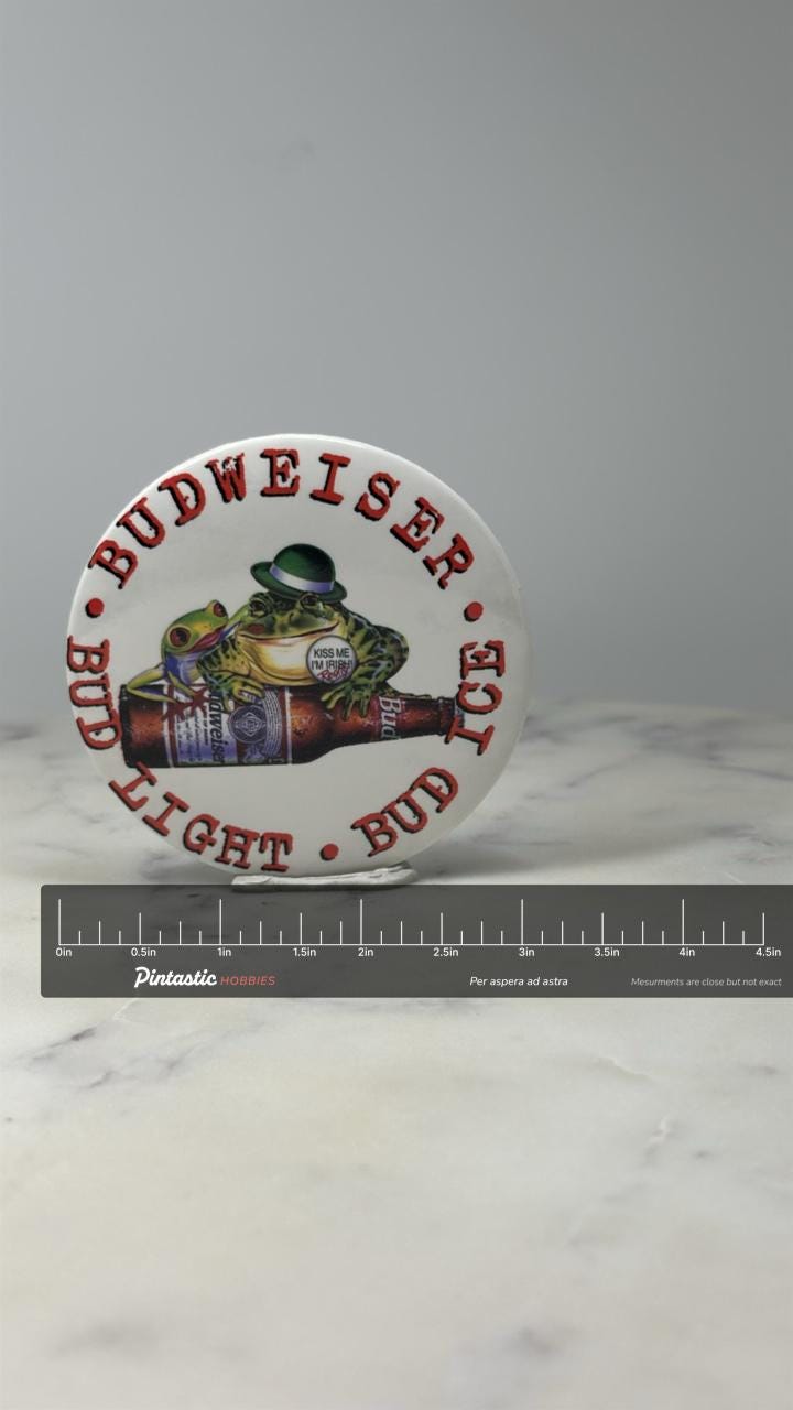 St. Patricks Day Budweiser Beer Button Pin: White Frog Graphic - 1990s Bar Promo with ruler overlay for size reference