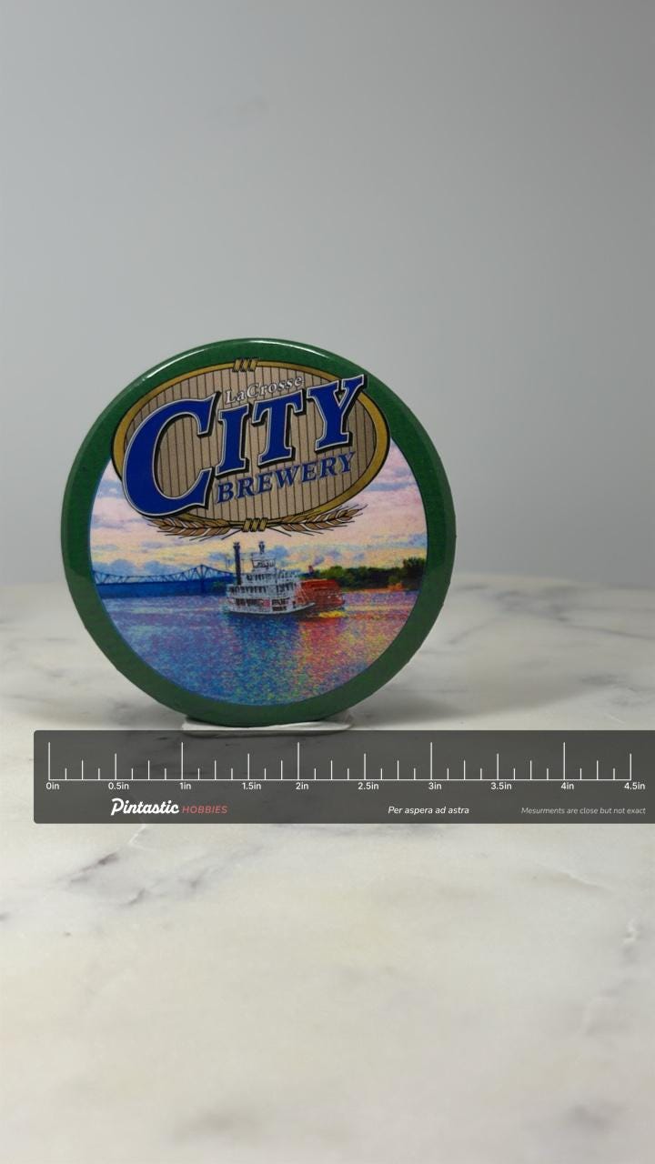 La Crosse City Brewery Button Pin: Green Button - Beer Ad Accessory with ruler overlay for size reference