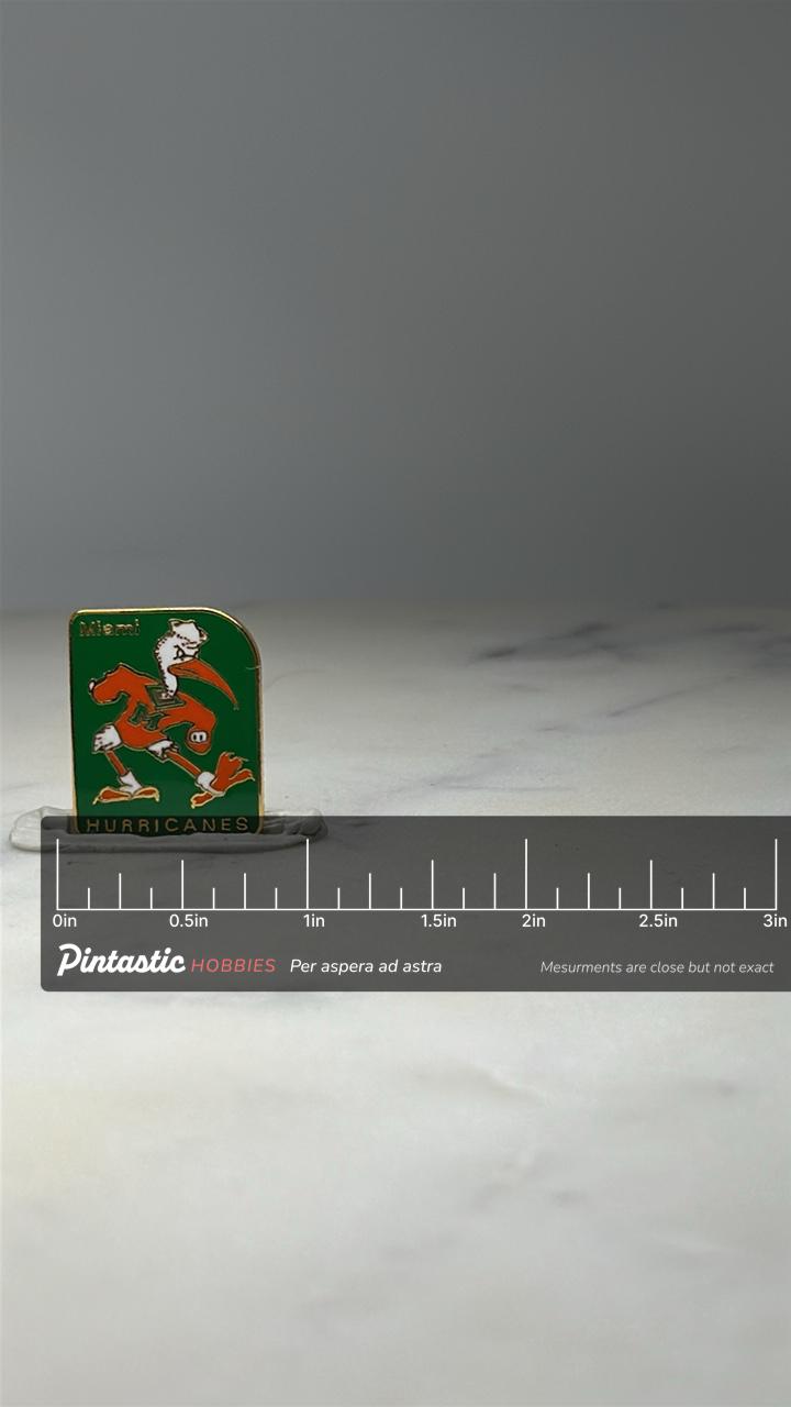 Miami Hurricanes Mascot Pin: Green Enamel - College Sports Accessory with ruler overlay for size reference