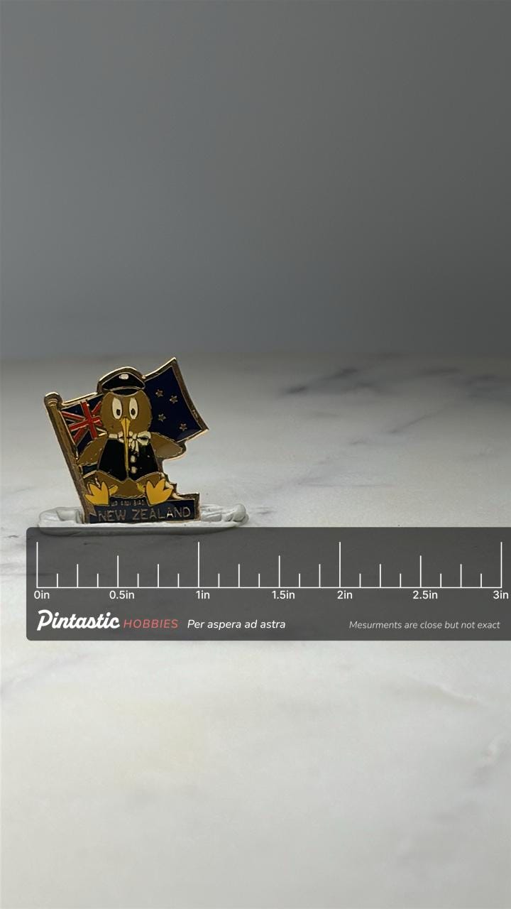 New Zealand Kiwi Bird Pin: Gold Tone Enamel - Travel Souvenir Accessory with ruler overlay for size reference