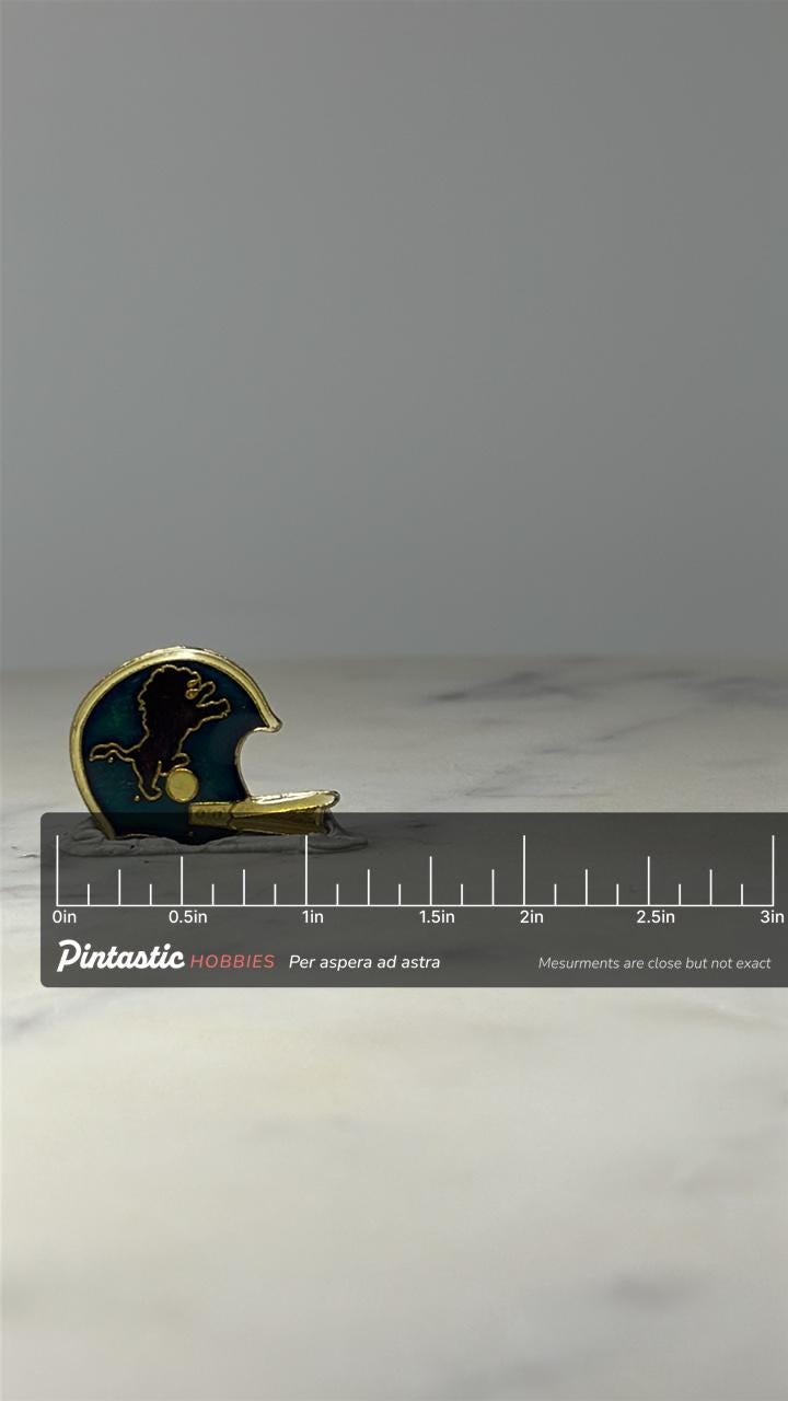 Vintage Detroit Lions Helmet Enamel Lapel Pin NFL Football Collectible with ruler overlay for size reference