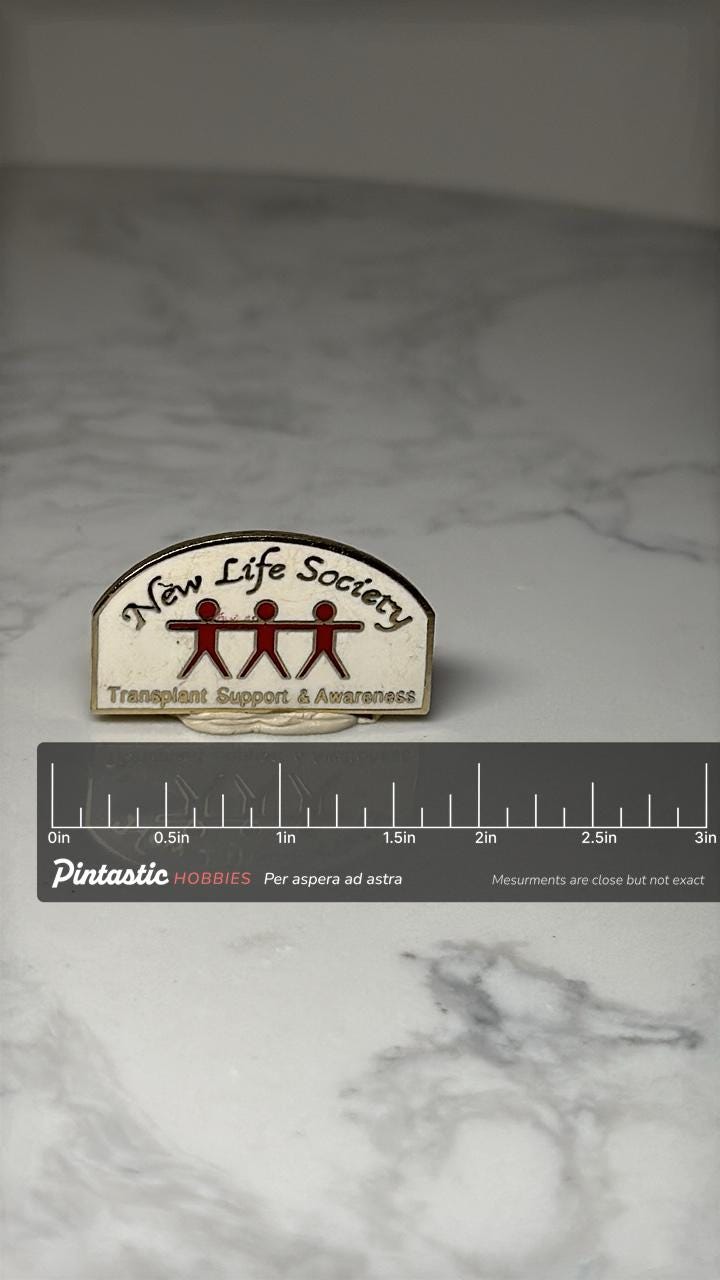 New Life Society Enamel Pin: Red & Gold - Transplant Awareness Accessory with ruler overlay for size reference