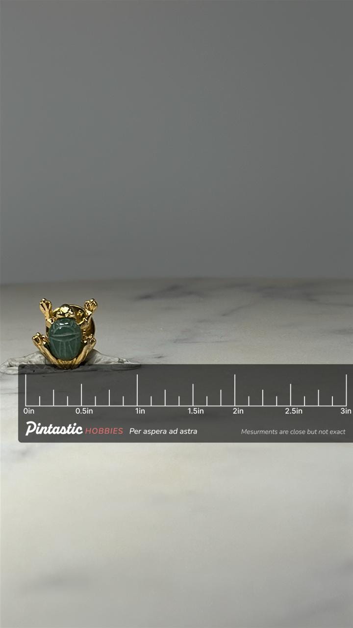 Egyptian Scarab Beetle Pin: Gold Tone & Green Stone - Vintage Accessory with ruler overlay for size reference