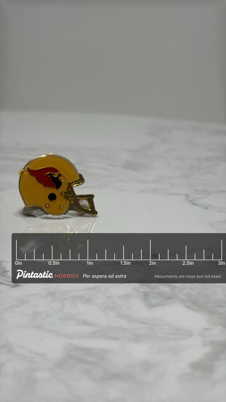 Arizona Cardinals Football Helmet Pin: Gold-Tone Enamel - Vintage Sports Accessory with ruler overlay for size reference