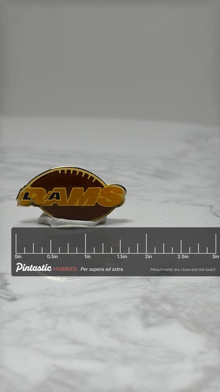 Rams Football Lapel Pin: Brown Gold Enamel - Vintage Sports Accessory with ruler overlay for size reference