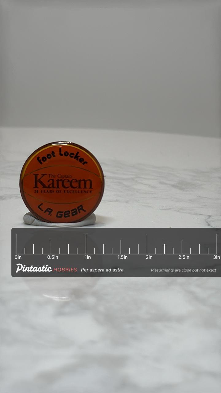 Kareem Abdul-Jabbar Basketball Pin: Red Enamel Finish - 90s Sports Accessory with ruler overlay for size reference