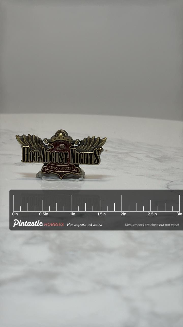 Hot August Nights Car Show Pin: Gold Red Wings Design - Retro Auto Accessory with ruler overlay for size reference