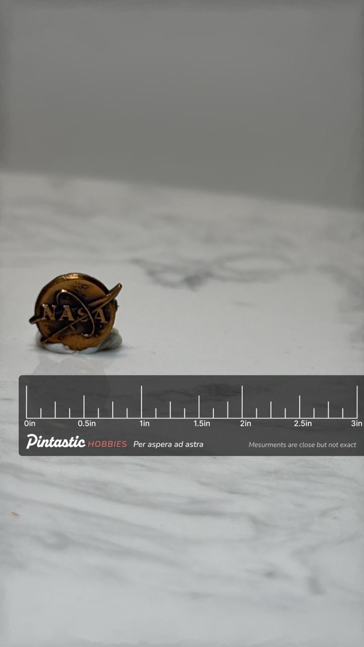 NASA Logo Pin: Brass Tone Enamel - Vintage Space Accessory with ruler overlay for size reference