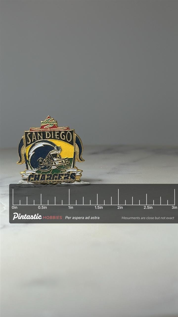 San Diego Chargers Football Pin: Enamel Logo - NFL Vintage Accessory with ruler overlay for size reference