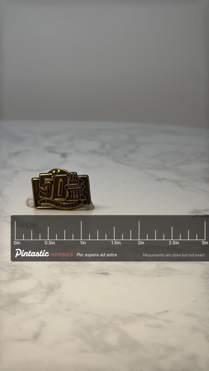Vintage Osco Drug 50th Anniversary Lapel Pin: Bronze Tone - Pharmacy Memorabilia with ruler overlay for size reference