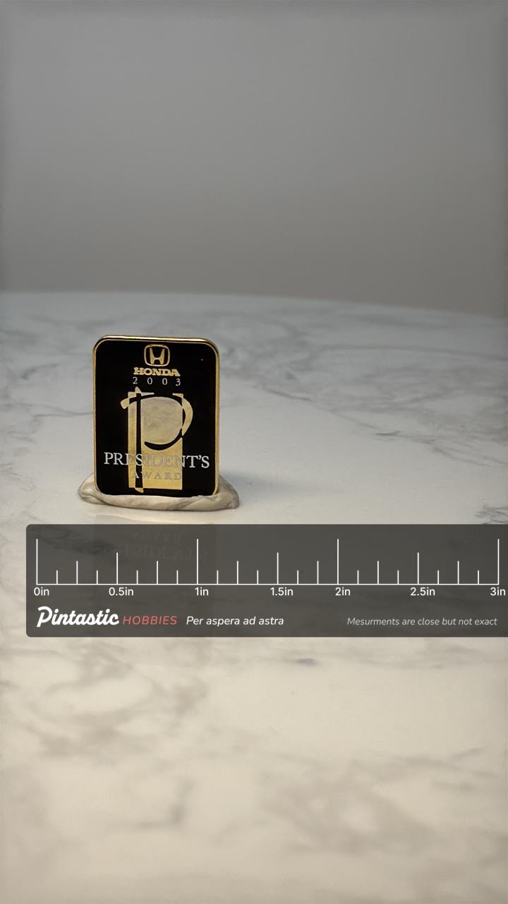 Vintage Honda President’s Award Pin: Black & Gold - 2003 Corporate with ruler overlay for size reference