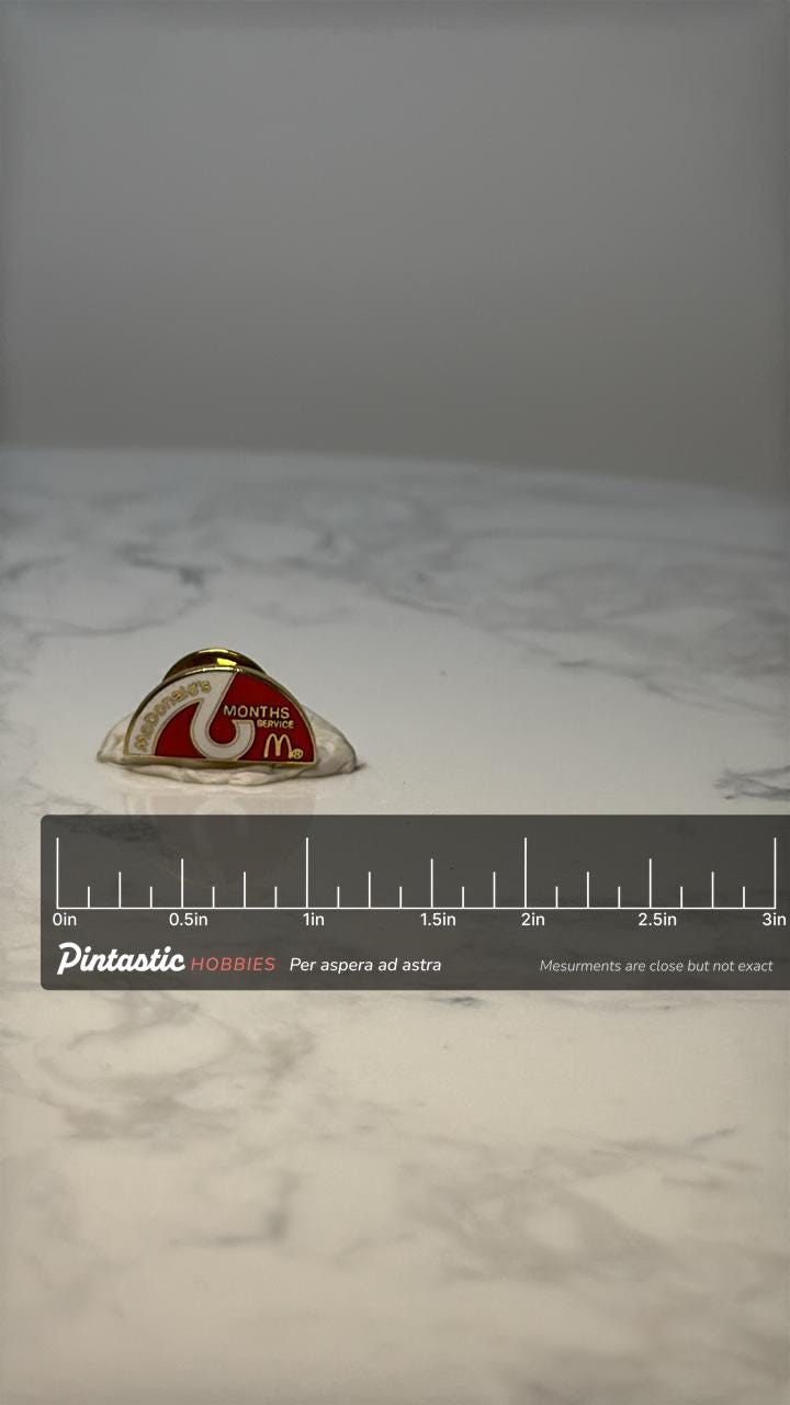 Vintage McDonalds 6 Months Service Lapel Pin: Red Gold Enamel - Employee Award with ruler overlay for size reference