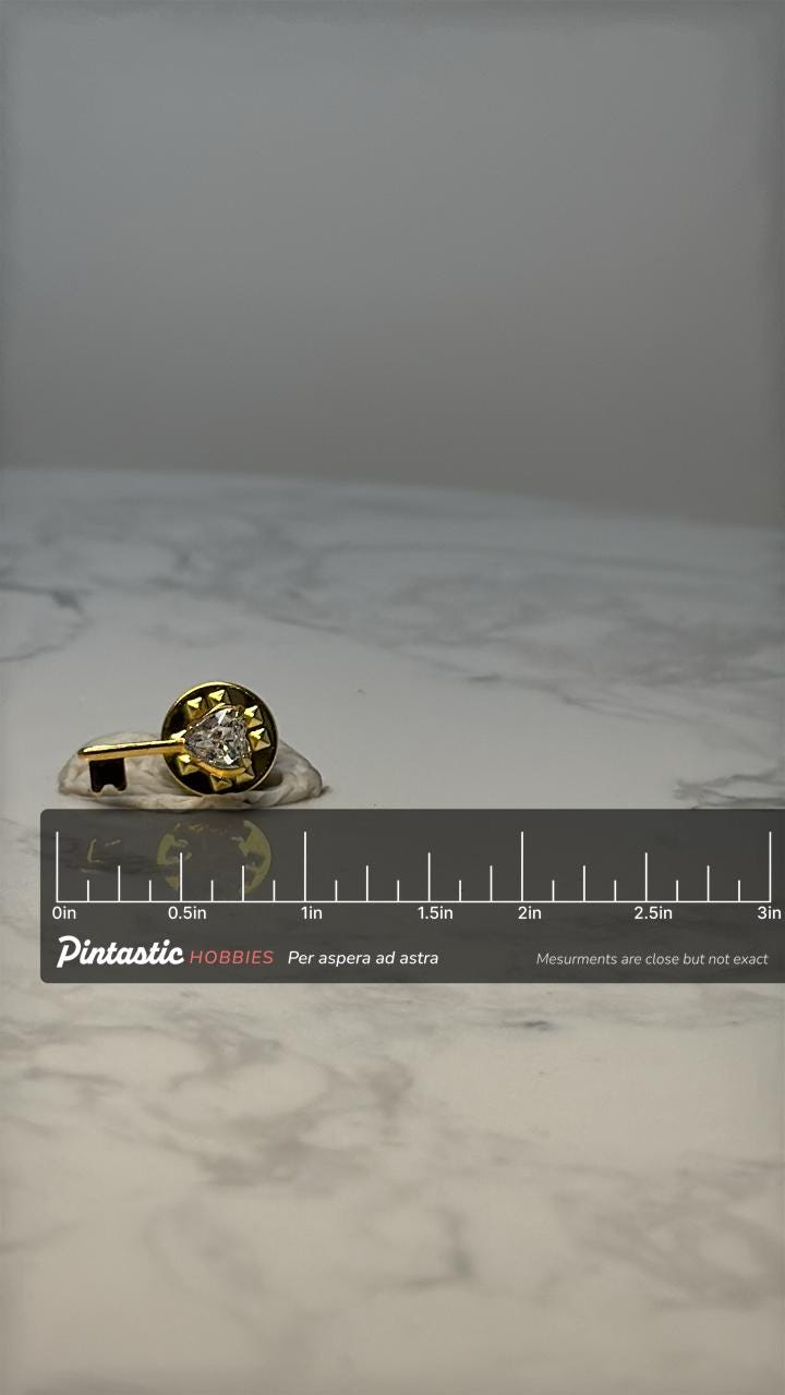 Vintage Gold Tone Key Pin: Rhinestone Accent - Retro Novelty Accessory with ruler overlay for size reference