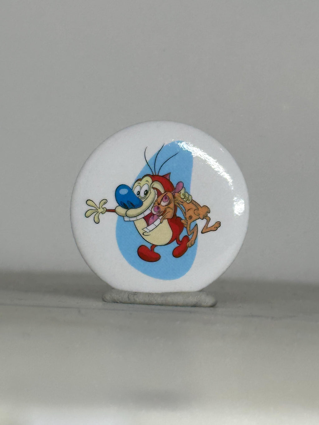 Vintage ren & stimpy button pin: classic cartoon white round - 90s nostalgia accessory