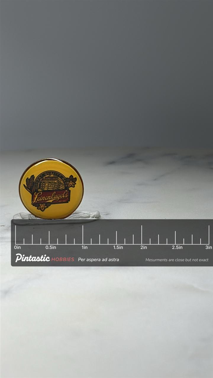 Leinenkugels Beer Advertising Pin: Yellow Enamel - Brewery Promo Accessory with ruler overlay for size reference