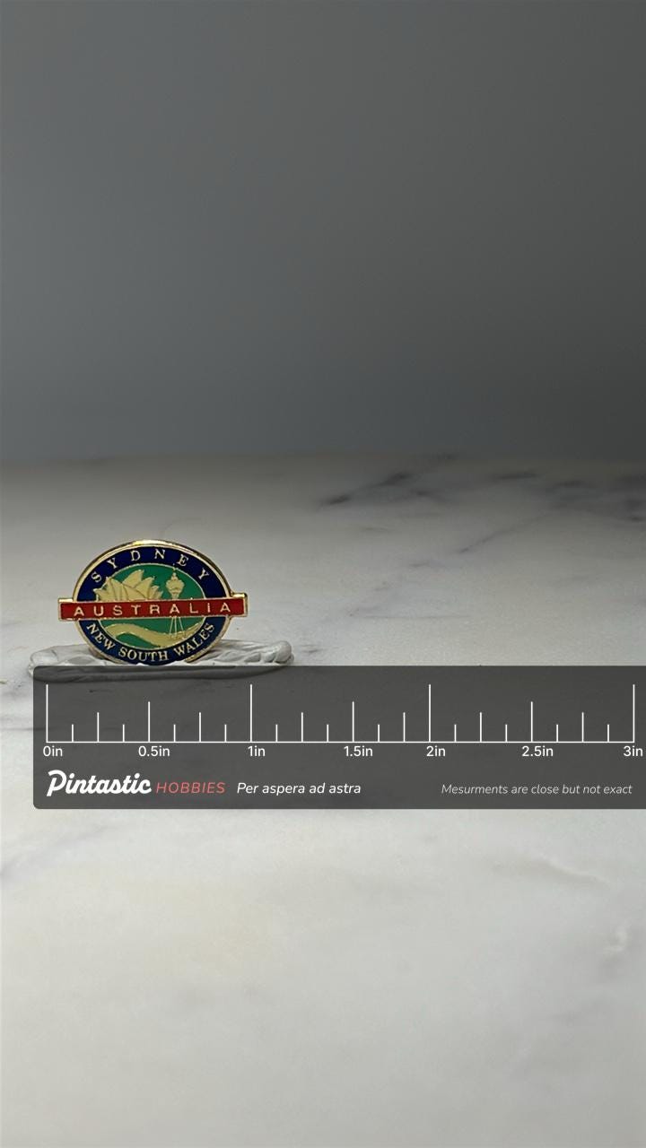 Sydney Australia Souvenir Pin: Gold Tone Enamel - Travel Accessory with ruler overlay for size reference