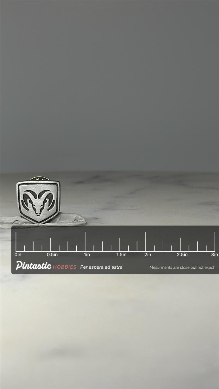 Dodge Ram Logo Pin: Silver Tone Shield - Truck Brand Accessory with ruler overlay for size reference