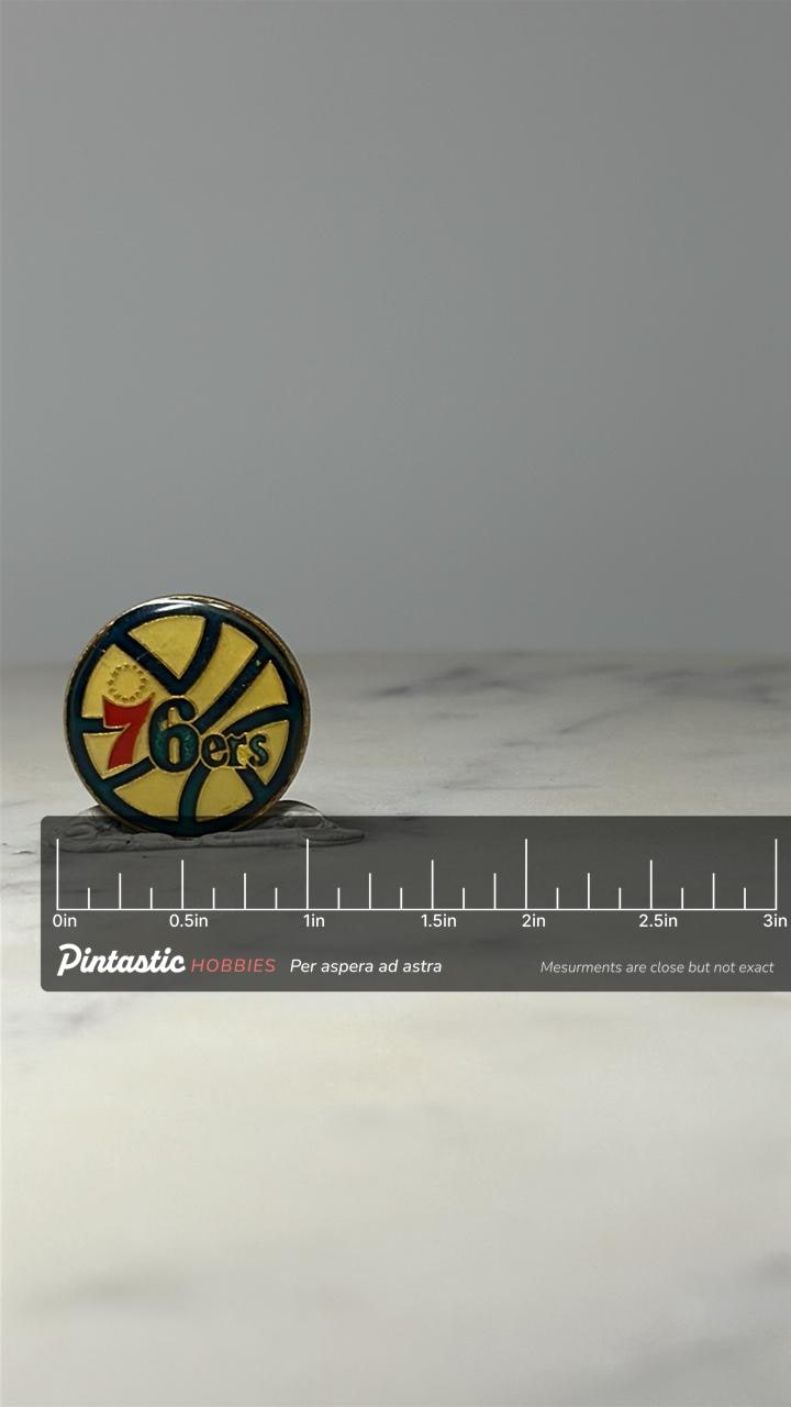 Philadelphia 76ers Logo Pin: Blue Yellow Enamel - NBA Vintage Accessory with ruler overlay for size reference