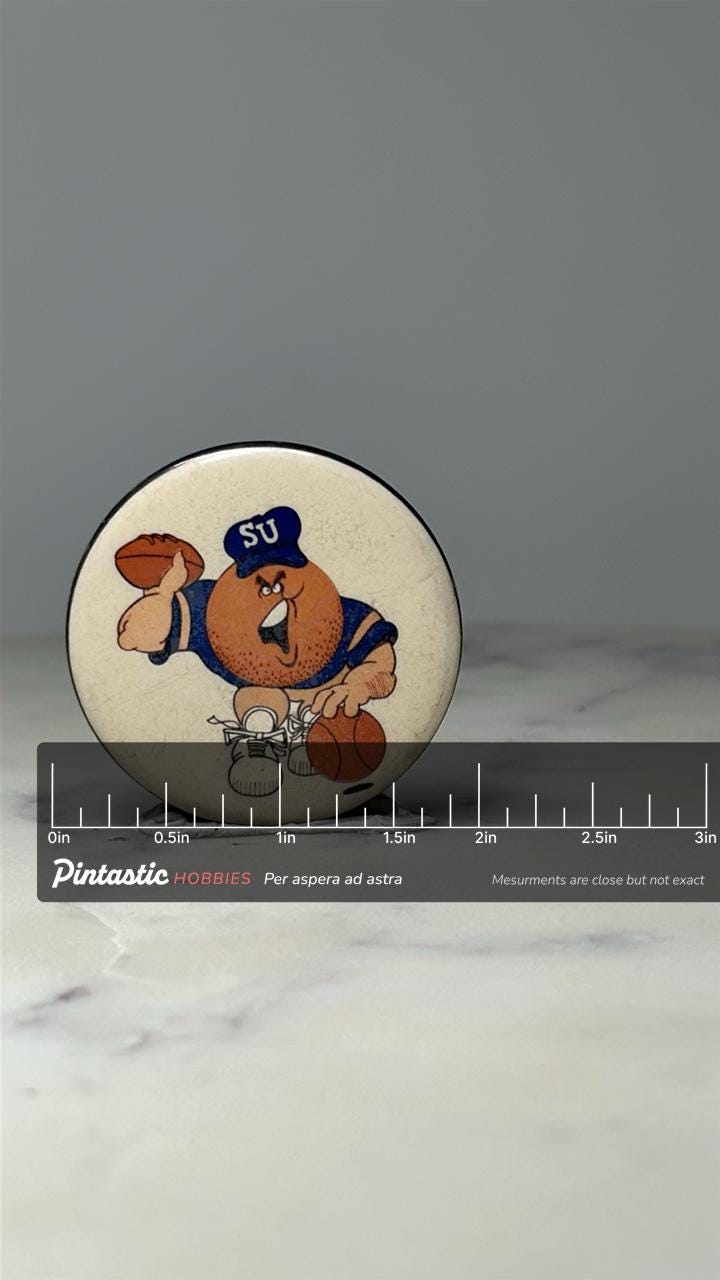 Syracuse University Orange Mascot Pin: Enamel Sports - Vintage College Accessory with ruler overlay for size reference