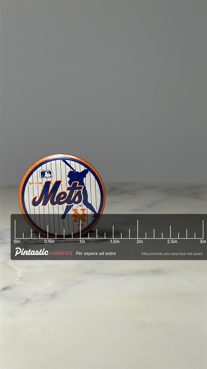 New York Mets Baseball Pin: Orange Blue Enamel - MLB Sports Accessory with ruler overlay for size reference