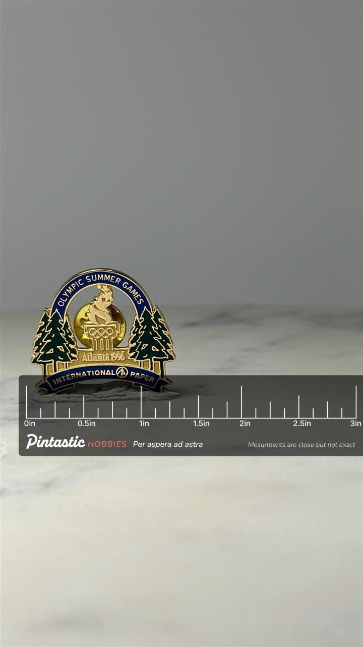 1996 Atlanta Olympic Games Pin: Gold Enamel - Corporate Sponsor with ruler overlay for size reference