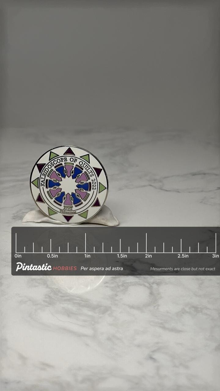 Kaleidoscope of Quilts Pin: Enamel Multicolor - 2022 Event Accessory with ruler overlay for size reference