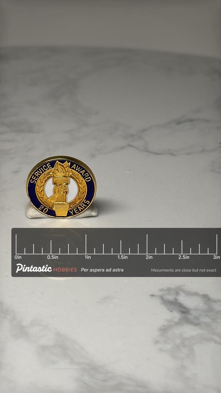 Sun Mountain Winthrop WA Souvenir Pin: Blue Enamel - Ski Resort Accessory with ruler overlay for size reference