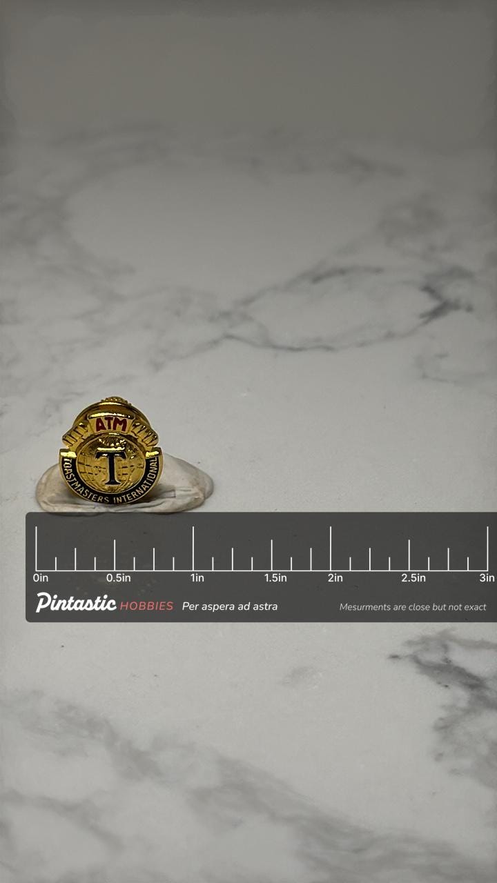 ATM Toastmasters International Lapel Pin: Gold Enamel - Award Accessory with ruler overlay for size reference