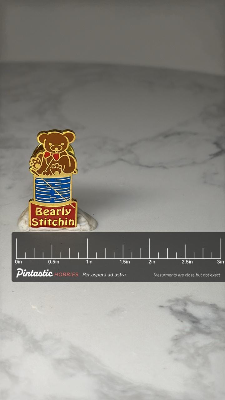 Bearly Stitchin Sewing Pin: Gold Tone Enamel - Craft Humor Accessory with ruler overlay for size reference