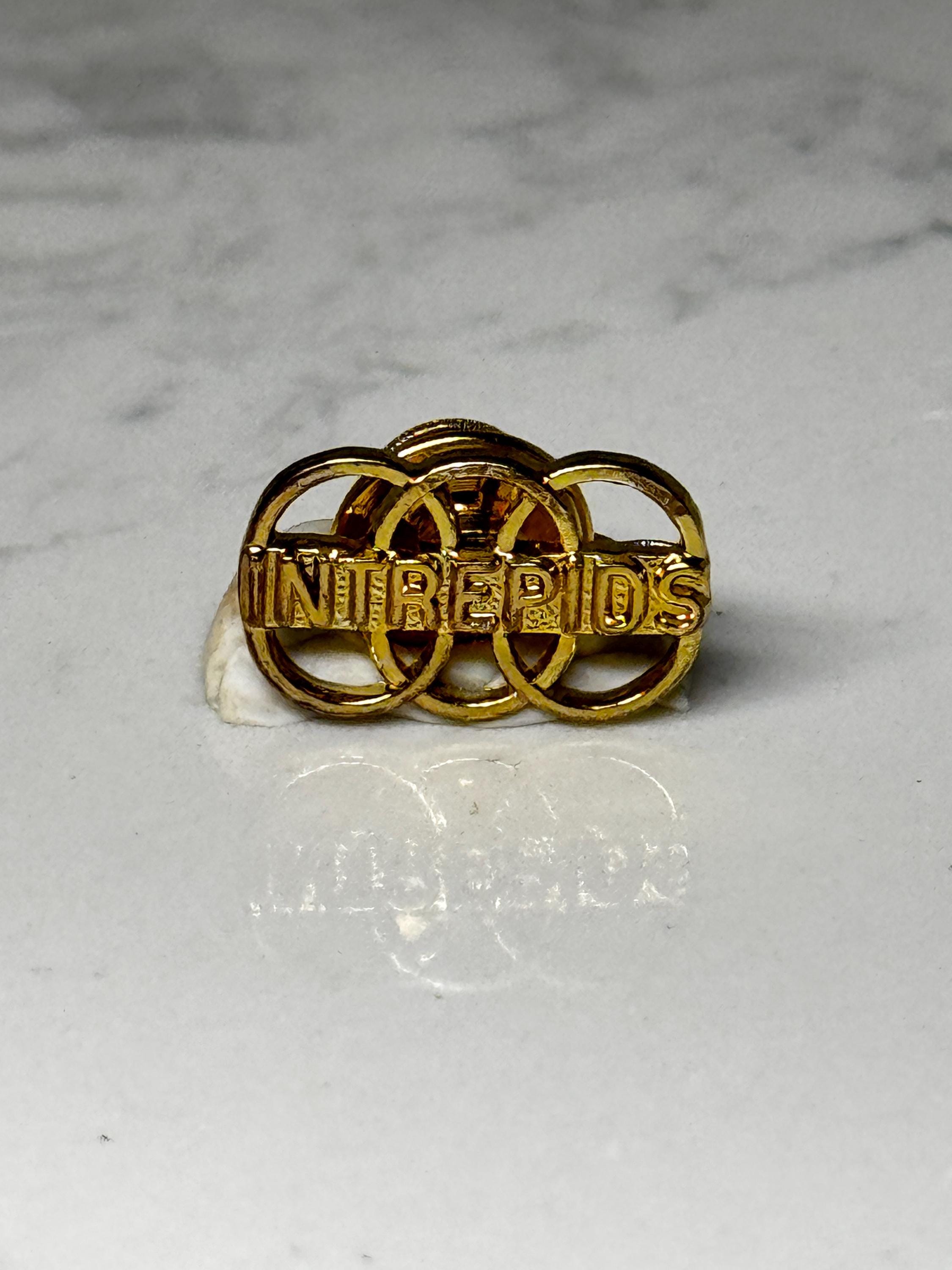Vintage INTREPIDS Lapel Pin: Gold Tone Team Club Badge – Rings Design