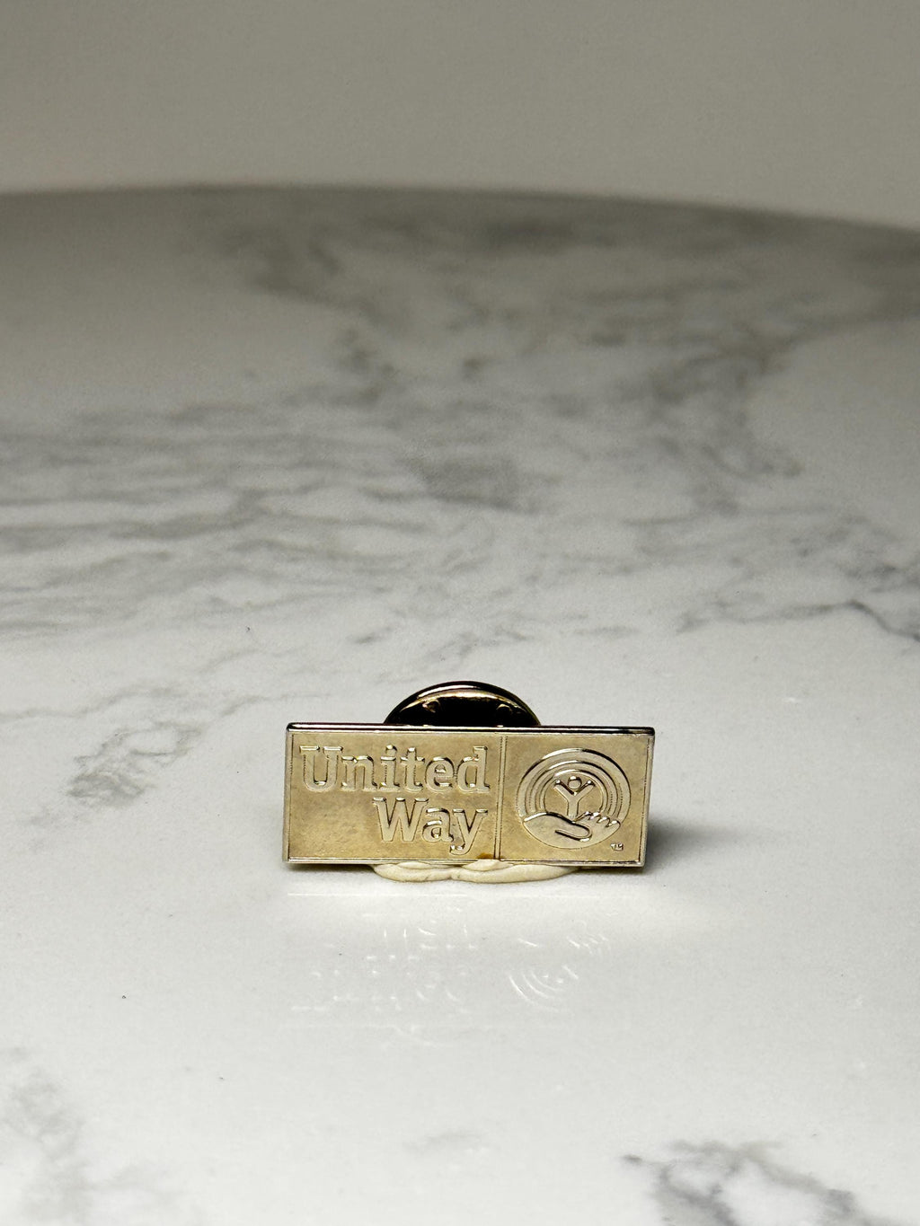 United Way Logo Pin: Gold Tone Corporate Charity Accessory