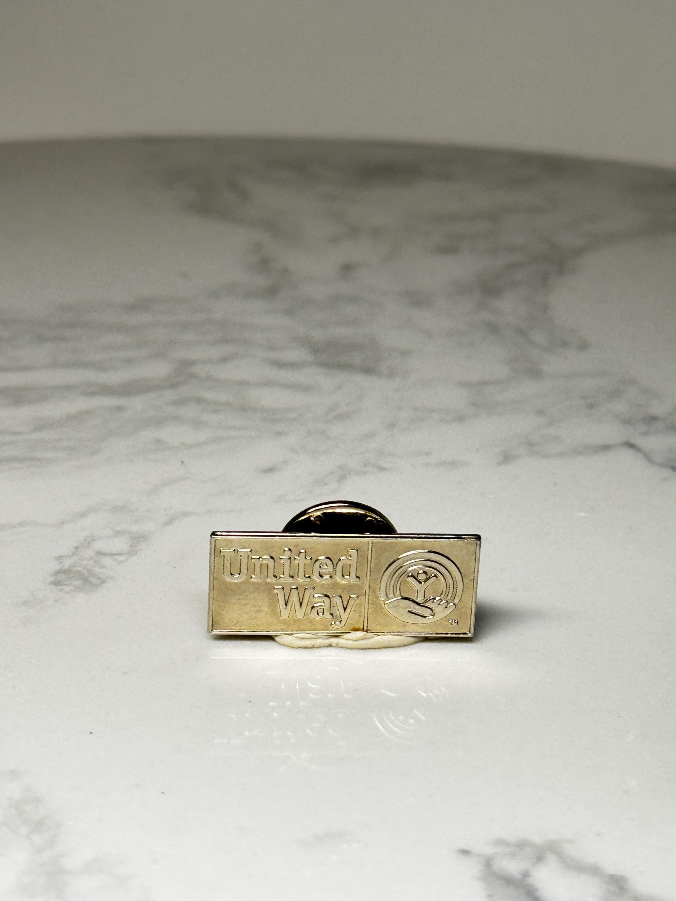 United Way Logo Pin: Gold Tone Corporate Charity Accessory