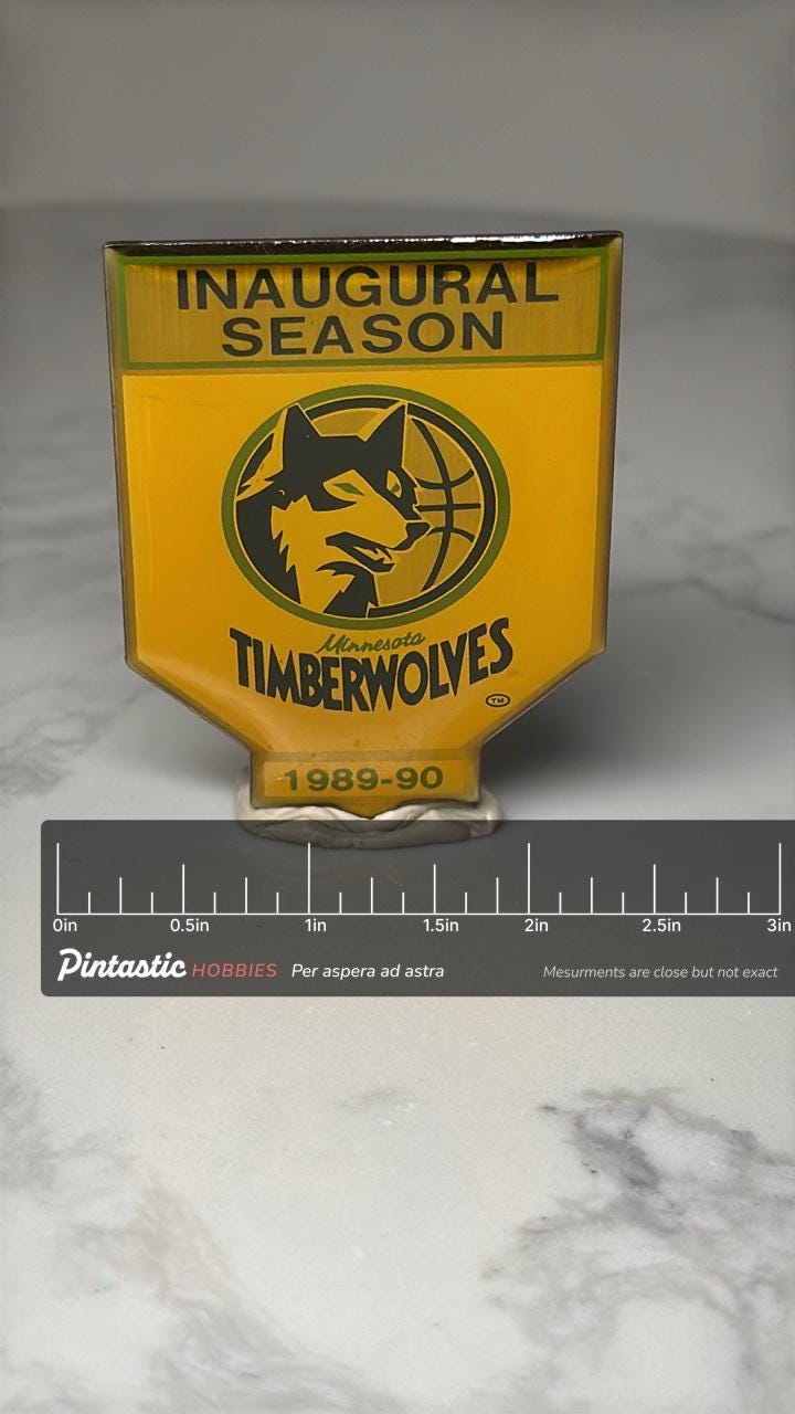 Minnesota Timberwolves Pin: Yellow Enamel - 1989 Inaugural Season Accessory with ruler overlay for size reference