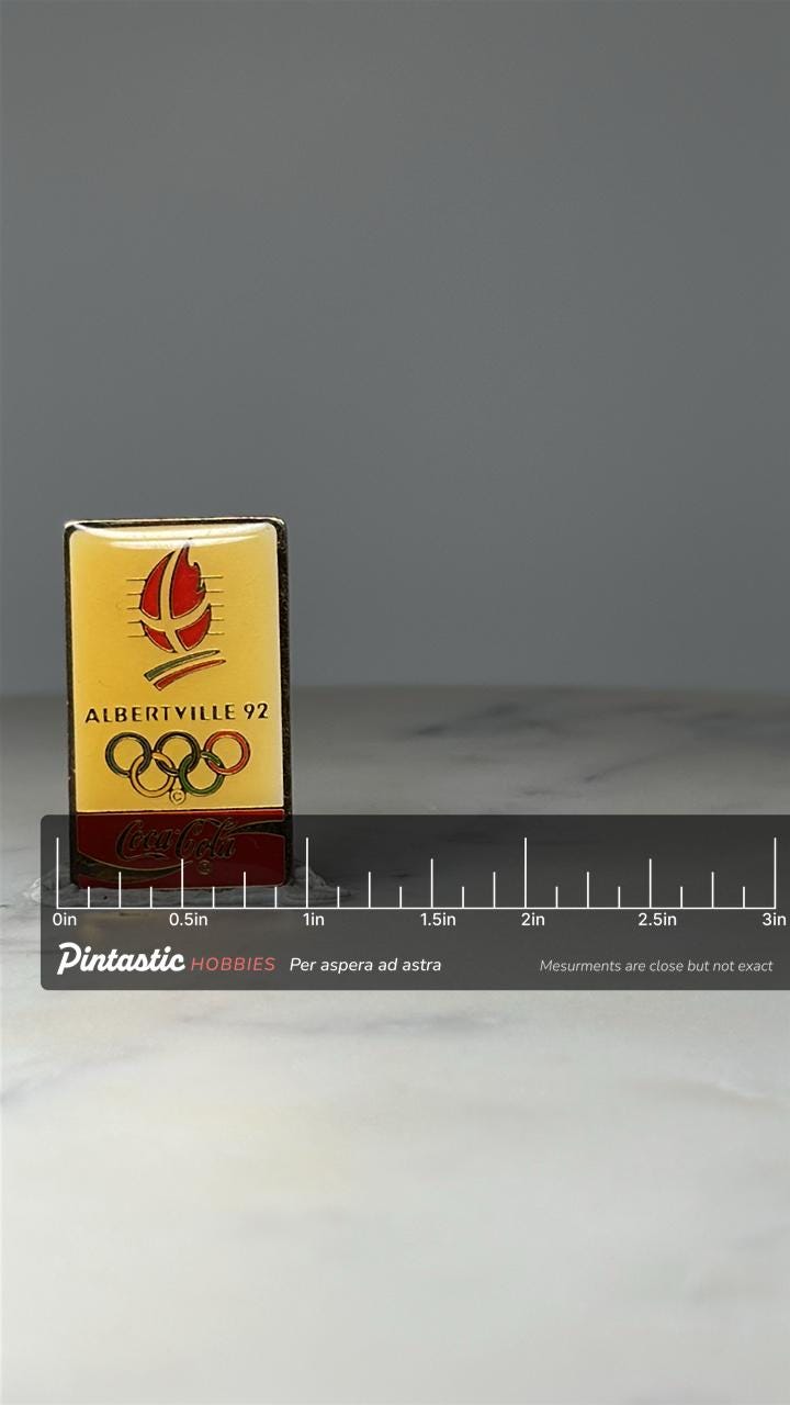 Albertville 92 Olympic Pin: Gold Enamel Coca Cola Sponsor - 1992 Winter Games Accessory with ruler overlay for size reference